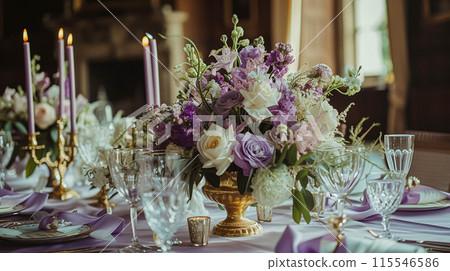 Wedding table decoration with lavender flowers, sweets, cake and candles 115546586