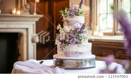 Wedding cake with lavender flowers. Festive table decoration. 115547003