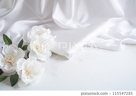 Floral composition. White flowers on white fabric. Flat lay, top view, copy space. 115547285