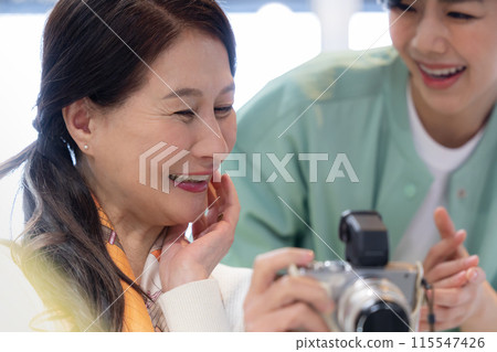 Hobby: Seniors taking lessons at a photography class Hobby: Seniors taking lessons at a photography class 115547426