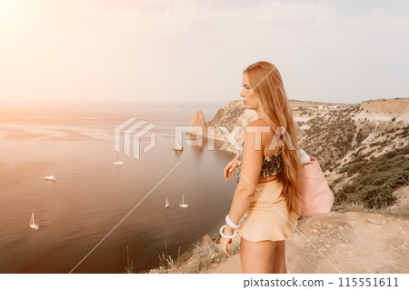 Woman travel sea. Happy tourist taking picture outdoors for memories. Woman traveler looks at the edge of the cliff on the sea bay of mountains, sharing travel adventure journey Woman travel sea. Happy tourist taking picture outdoors for memories. Woman traveler looks at the edge of the cliff on the sea bay of mountains, sharing travel adventure journey 115551611