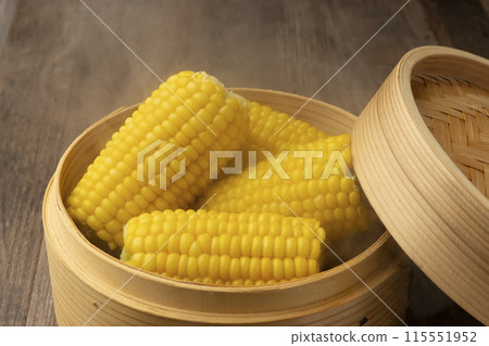 Steaming corn in a bamboo steamer Freshly steamed Steaming corn in a bamboo steamer Freshly steamed 115551952