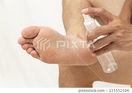 Spray and man's legs on white background Spray and man's legs on white background 115552104
