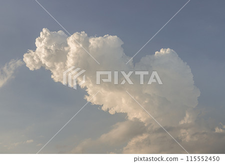 The sky is being covered with fluffy white clouds. Amazing clouds like a heaven for background wallpaper and texture. 115552450