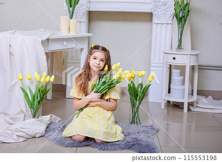 A beautiful girl in a yellow dress against the background of bouquets of yellow tulips. Congratulations on Mother's Day, Women's Day, March 8 A beautiful girl in a yellow dress against the background of bouquets of yellow tulips. Congratulations on Mother's Day, Women's Day, March 8 115553198