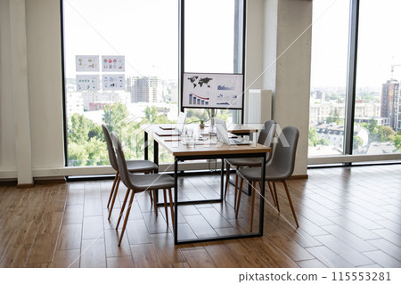 Modern conference room with panoramic city view and presentation board 115553281