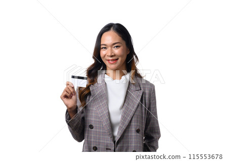 Confident businesswoman holding credit card standing against white background 115553678