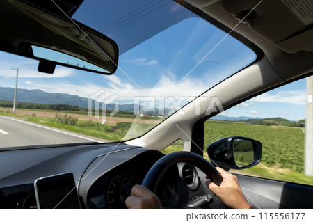 Driver's seat of a car driving through rural areas Driver's seat of a car driving through rural areas 115556177