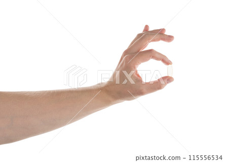 Male hand hold transparent pill isolated on white 115556534