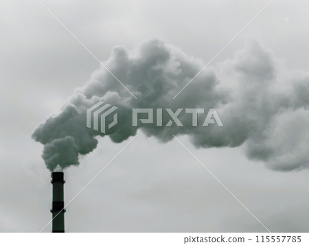 Gray smoke from the chimney against a background of gloomy sky. Gray smoke from the chimney against a background of gloomy sky. 115557785