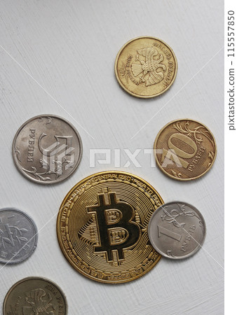 Vertical photo of metal coins, top view. 115557850