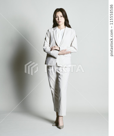 A woman wearing a suit on a white background 115558586