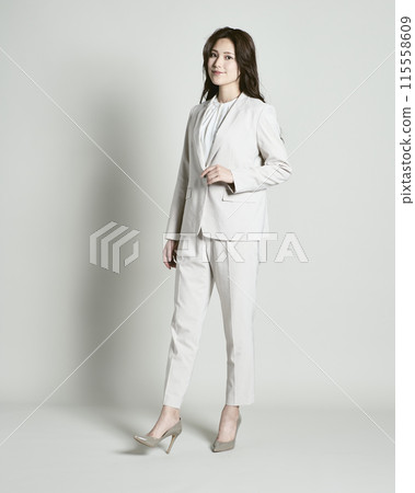 A woman wearing a suit on a white background 115558609