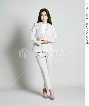 A woman wearing a suit on a white background 115558610