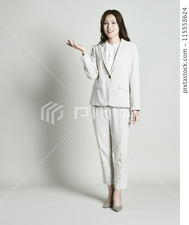 A woman wearing a suit on a white background 115558624