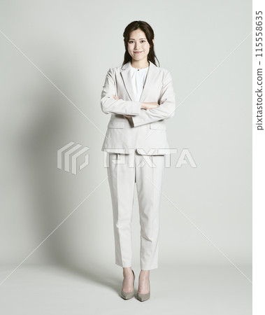 A woman wearing a suit on a white background 115558635