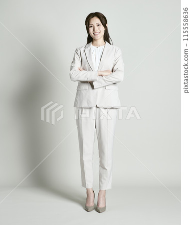 A woman wearing a suit on a white background 115558636