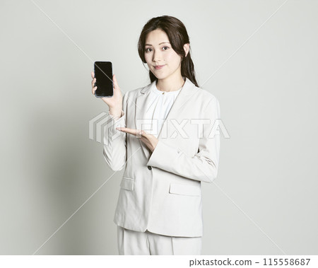 A woman wearing a suit on a white background A woman wearing a suit on a white background 115558687