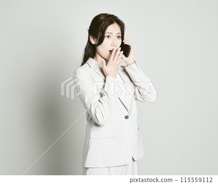 A woman wearing a suit on a white background 115559112