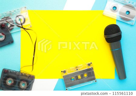 Microphone and cassette on blue background with copy space Microphone and cassette on blue background with copy space 115561110