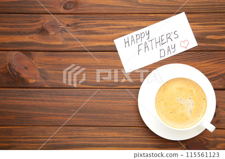 Fathers Day message with coffee cup on brown wooden background 115561123