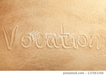 The inscription Vocation on the sandy beach. Summertime 115561348