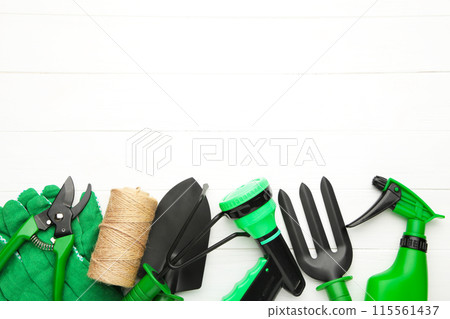 Gardening tools on white wooden background, top view Gardening tools on white wooden background, top view 115561437