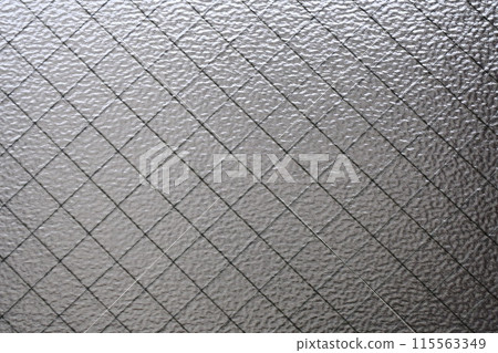 Light coming through wire glass 115563349