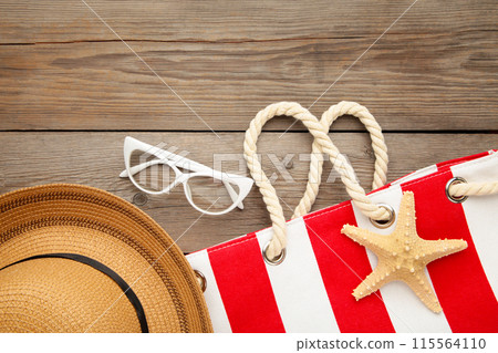 Beach accessories on grey wooden background. Top view 115564110