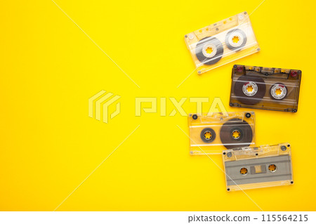 Inscription music day with old cassettes on a yellow background. Music day Inscription music day with old cassettes on a yellow background. Music day 115564215