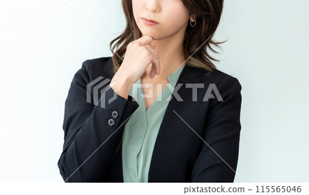 A woman thinking/businesswoman A woman thinking/businesswoman 115565046