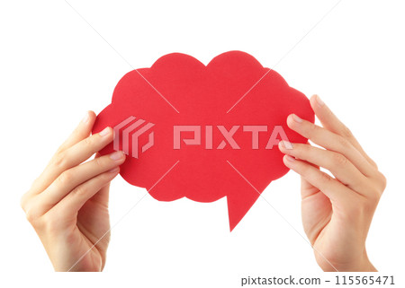 Hand holding an red empty speech bubble isolated on white background Hand holding an red empty speech bubble isolated on white background 115565471