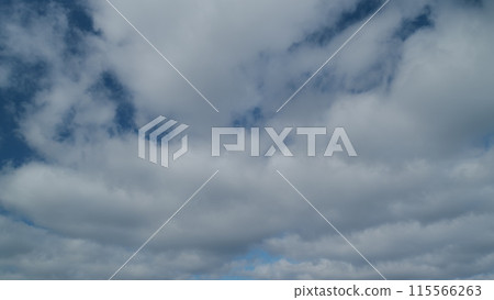 Beautiful blue sky with stratocumulus clouds background. Sky with clouds weather nature cloud blue. Timelapse. 115566263