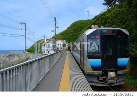 A train leaving Senjojiki Station with a view of the sea A train leaving Senjojiki Station with a view of the sea 115566332
