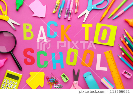 School supplies with inscription back to school on pink concrete background 115566631