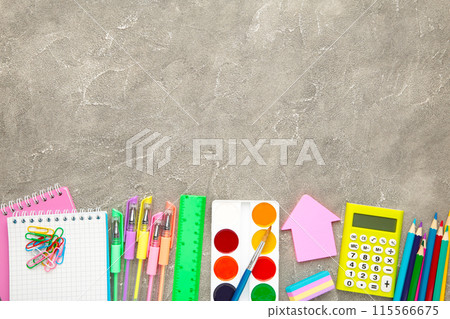 Back to school concept on grey concrete background. Top view Back to school concept on grey concrete background. Top view 115566675