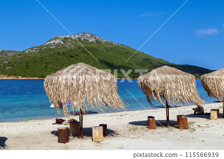 Thatched umbrellas, Chalkidiki, Greece Thatched umbrellas, Chalkidiki, Greece 115566939