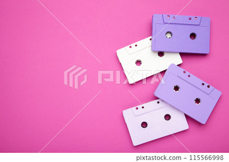 Old colorful cassettes on a pink background. Music day 115566998