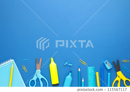 School supplies on blue background with copy space. Back to school. Flat lay. School supplies on blue background with copy space. Back to school. Flat lay. 115567117