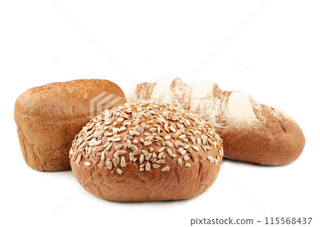 Assortment of different types of bread isolated on a white background Assortment of different types of bread isolated on a white background 115568437