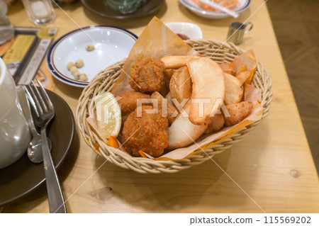 Fried potato chips, fried chicken, potato chips Fried potato chips, fried chicken, potato chips 115569202