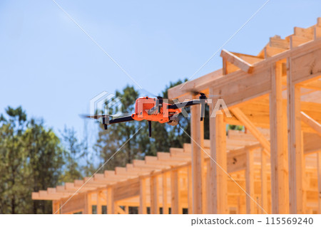 An inspection of construction site work using drone is conducted by supervisor for contractor An inspection of construction site work using drone is conducted by supervisor for contractor 115569240