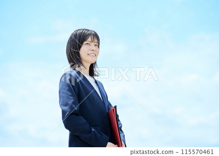 Outdoor portrait of young business woman 115570461