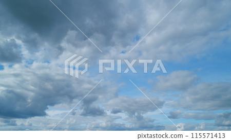 Fluffy clouds sky atmosphere. Puffy fluffy white clouds. Cloud sky scape. Timelapse. 115571413