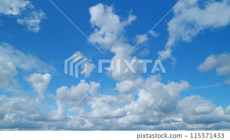 Dramatic summer cloudscape. Blue sky white clouds. Changing cloudscape. Timelapse. 115571433