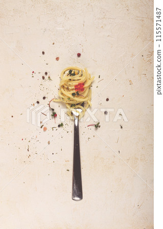 spaghetti strung on a fork, on the table, dish concept, dish background, top view, 115571487