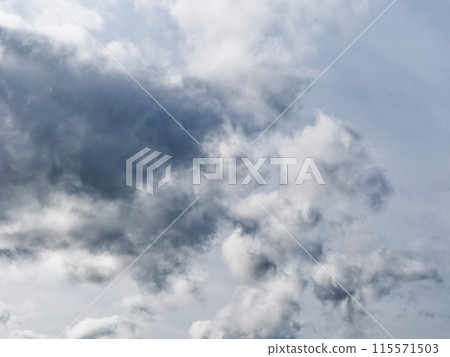 A sky filled with clouds suggests changing weather, ideal for meteorological study. A sky filled with clouds suggests changing weather, ideal for meteorological study. 115571503