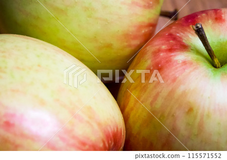 Natural Apples Close-Up. Close-up of apples, highlighting their natural beauty, great for culinary use. 115571552