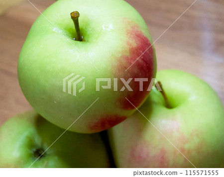 Farm Fresh Fruit. Apples displayed on wood, perfect for farm-to-table concepts. 115571555