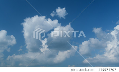 White clouds float across the blue sky. Puffy fluffy soft clouds. Timelapse. White clouds float across the blue sky. Puffy fluffy soft clouds. Timelapse. 115571707